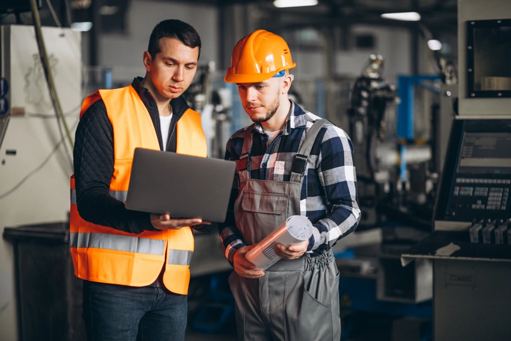 Workers using laptop